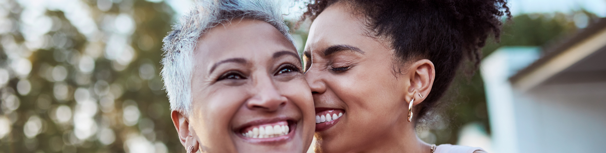 mother and daughter smiling